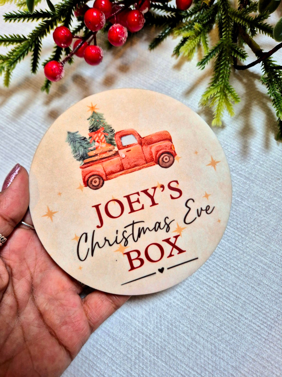 Christmas Truck personalised Christmas Eve Box disc held in hand