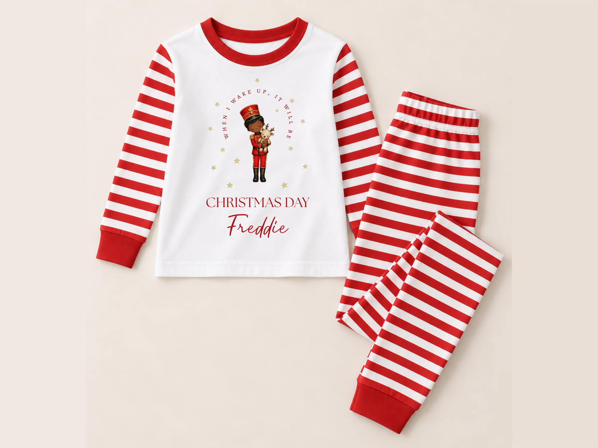 Personalised nutcracker Christmas pyjamas in red-and-white stripes with Freddie name
