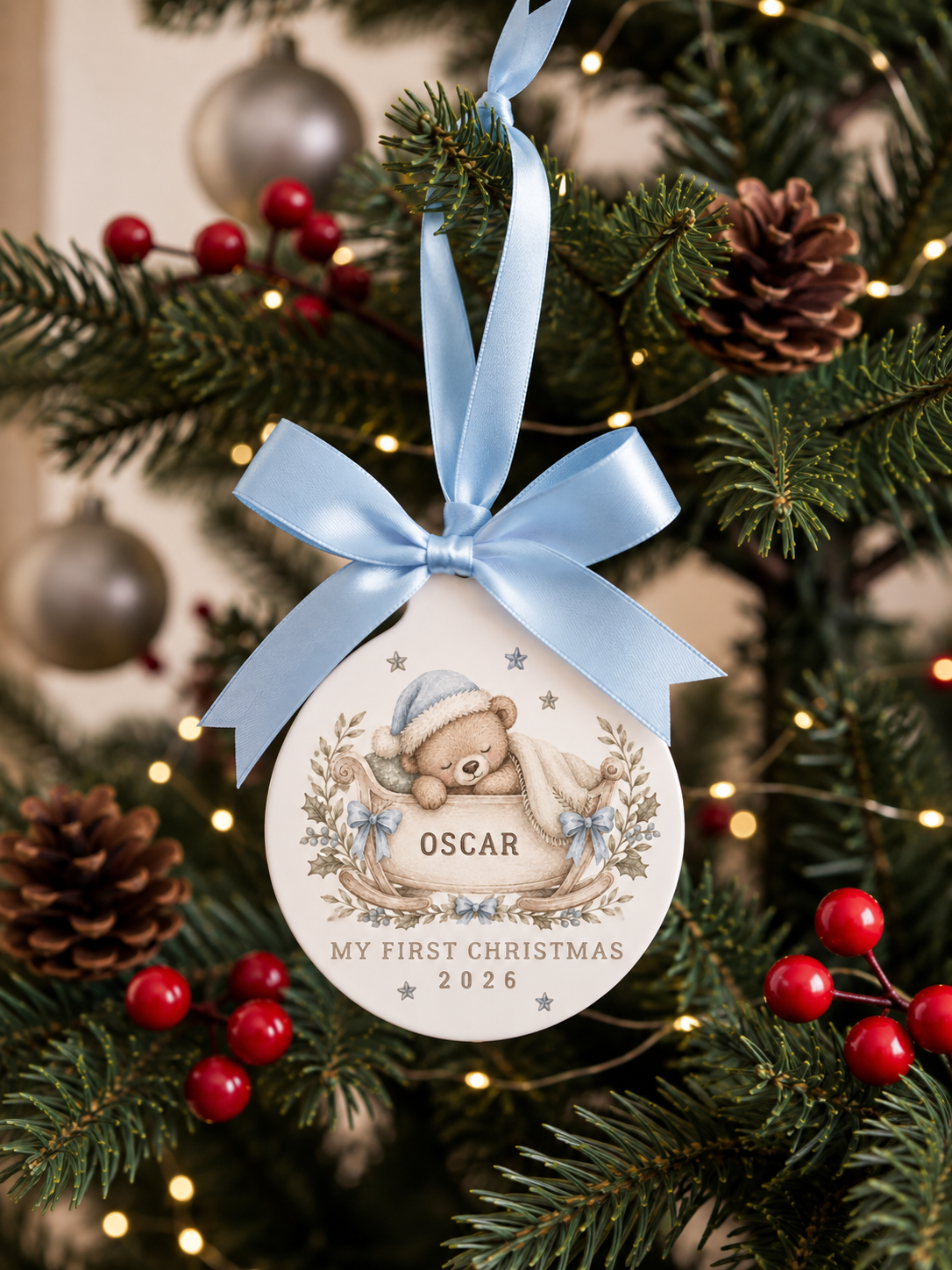 Personalised blue teddy bear sleigh first Christmas ornament with name and year on Christmas tree