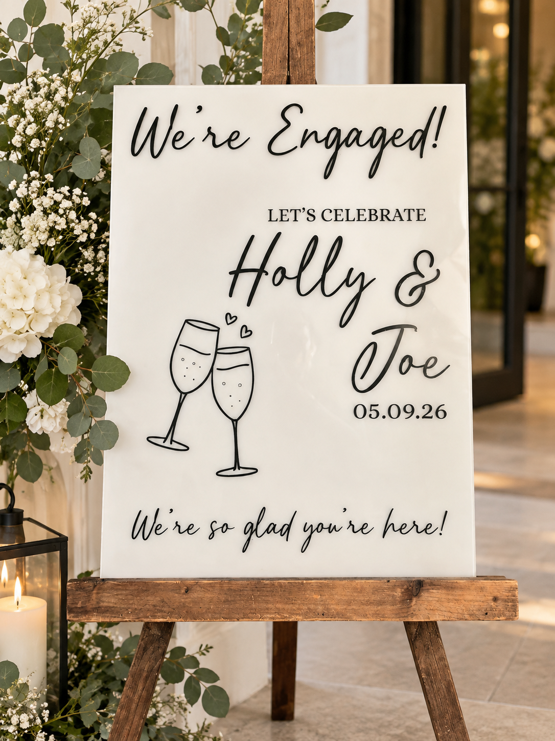 Personalised We're Engaged engagement party welcome sign on wooden easel