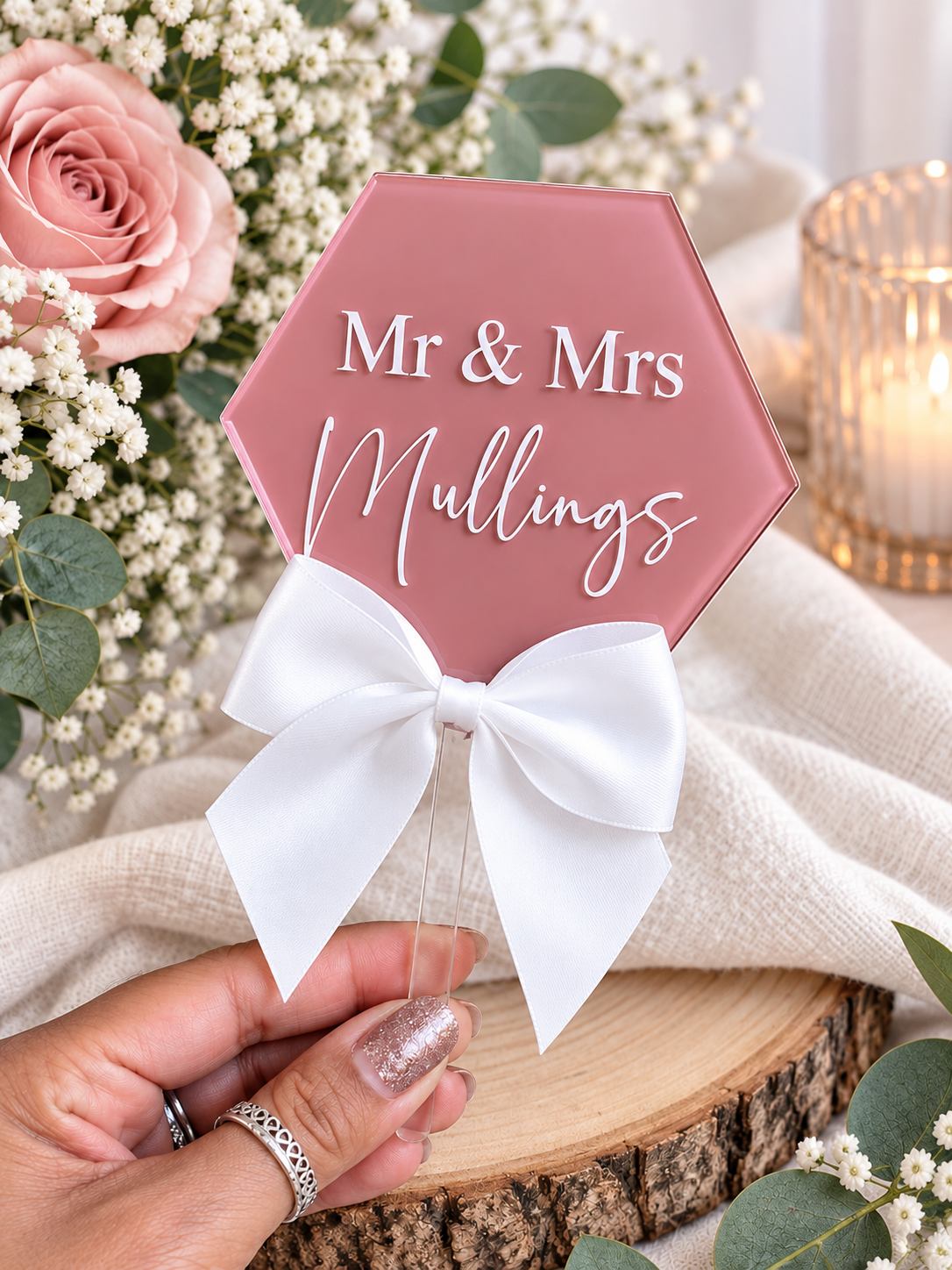 Personalised pink hexagon Mr and Mrs surname wedding cake topper with white satin bow
